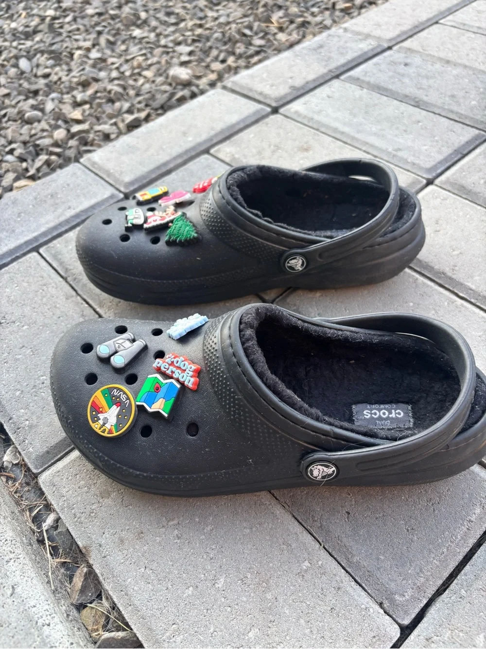 These are black lined classic black CROC Clogs featuring holiday Jibbitz charms